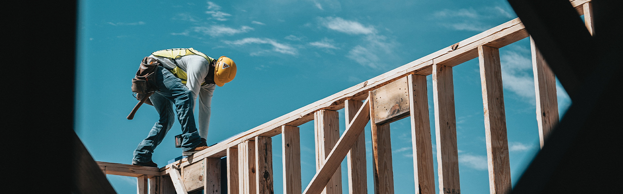 Carpenter framing a residential house.